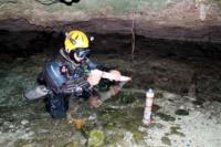 Brian Kakuk prepares radiolocation transmitters for deployment in Ralph's Cave, Abaco Island. Photo by Nancy Albury